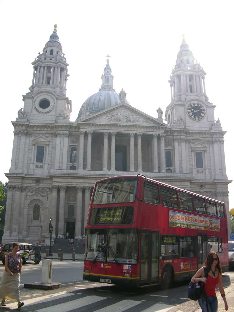 London St. Pauls Cathedral 01 Outside Full View St. Pauls Cathedral was initially built in 604AD, and was rebuilt in 675, 962 and 1087. Following the Reformation, the cathedral fell into disrepair. Inigo Jones began its restoration in 1633, adding a neo-classical portico. Sir Christopher Wren submitted a proposal for rebuilding, which the Fire of London in 1666 allowed to be realized. Wrens design received approval in 1675 with construction being finished in 1710. Here is a full view of St. Pauls Cathedral from the west, with the Bell and Lantern at the very top 111m above the church floor, and the Clock Tower to the right.